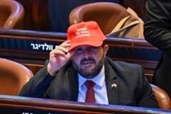 People wear hats that read "Trump The Peace President" before President Donald Trump speaks to the Knesset, Israel's parliament, on October 13, 2025.
